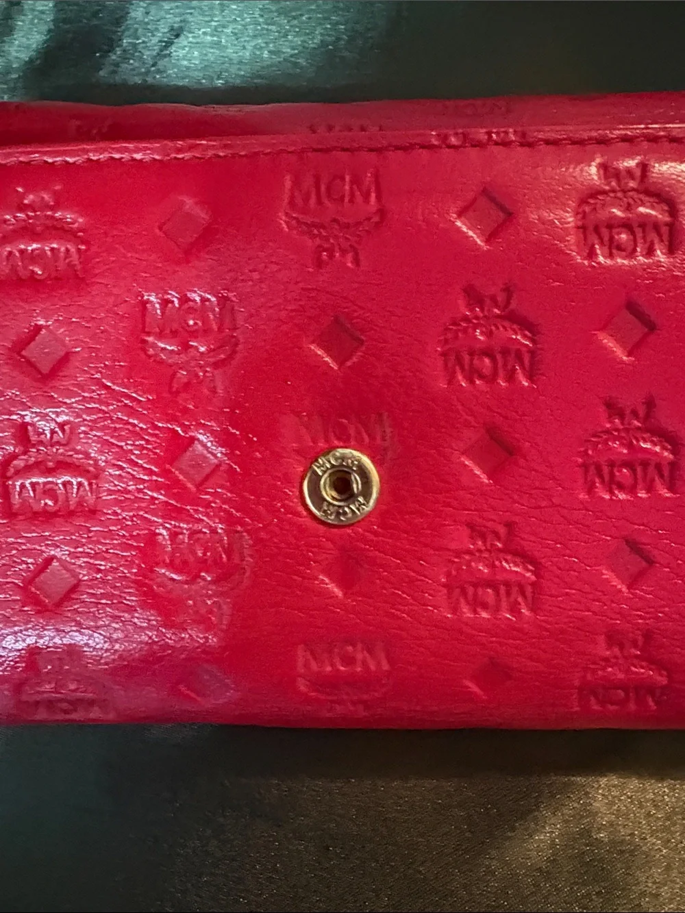 MCM Red Embossed Leather Trifold Wallet with Gold Plaque Accent